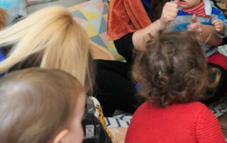 staff interacting with nursery children