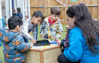 Playing with educational toys at Monkey Puzzle Day Nursery Stoke Newington, fostering early childhood development and social skills in a safe, nurturing environment.